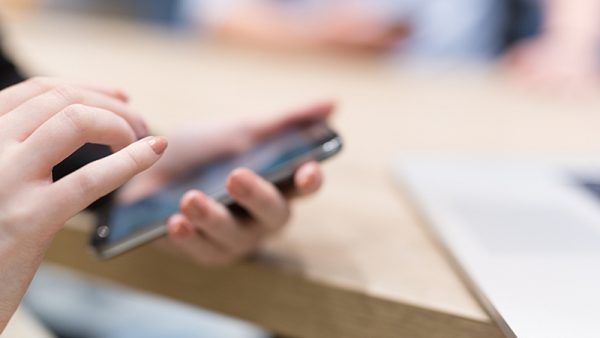 hands holding a cell phone