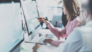 People working together on computers.