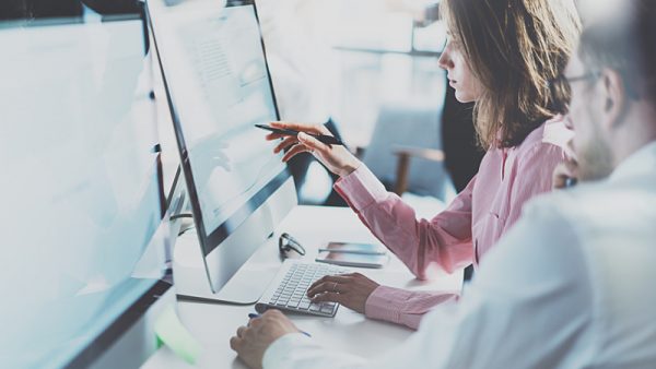 People working together on computers.